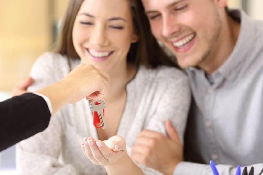 Homeowners receiving their new house keys