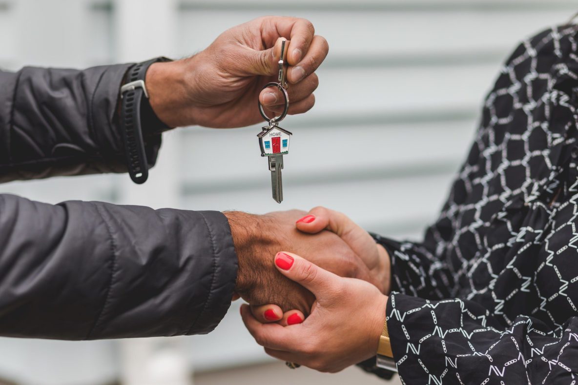 New homeowner receiving house key