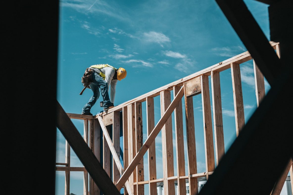 Construction worker framing a house