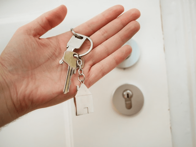 Person holding house keys