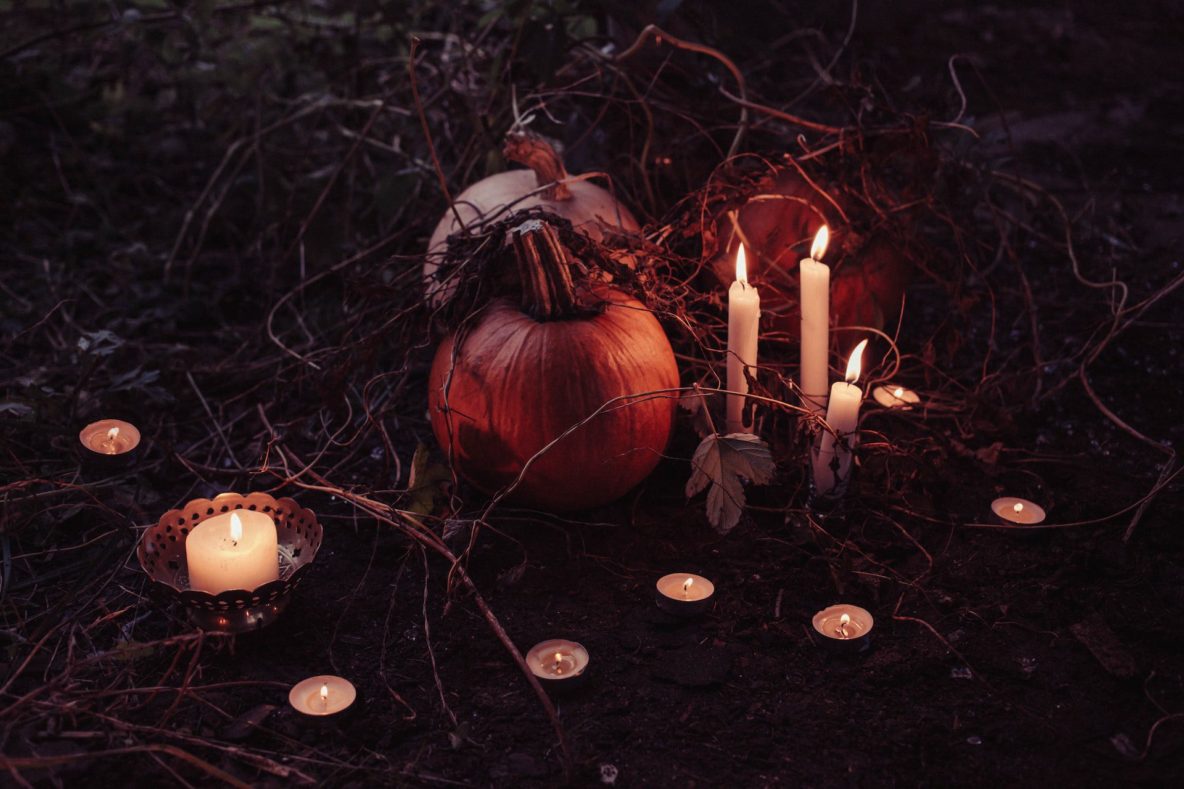 Pumpkin surrounded by candles