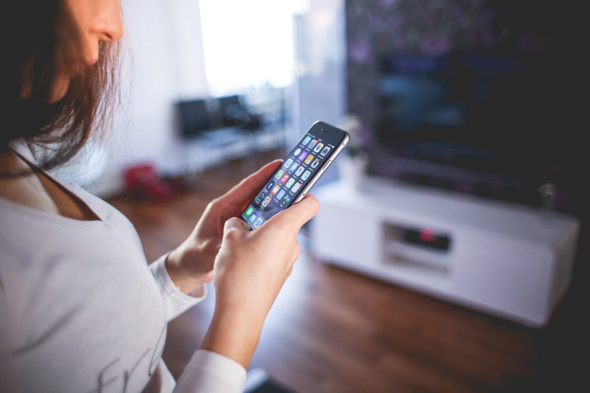 Woman using an iPhone